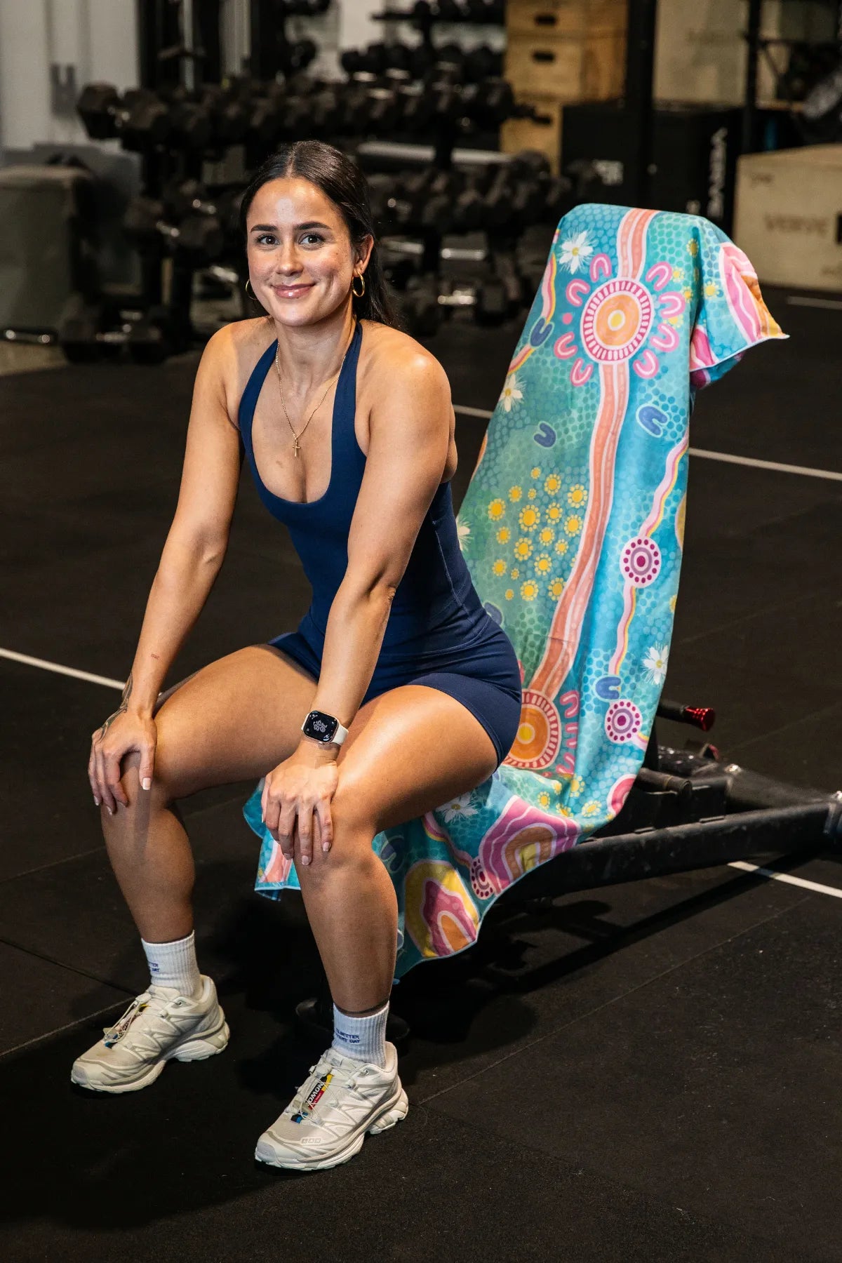 Endless Summer Indigenous hooded gym towel by Aboriginal artist Mirii Art featuring vibrant colours, 140x60cm with zip pocket in hood, stays on gym bench, quick-dry and odour resistant by Cheeky Winx Australia.