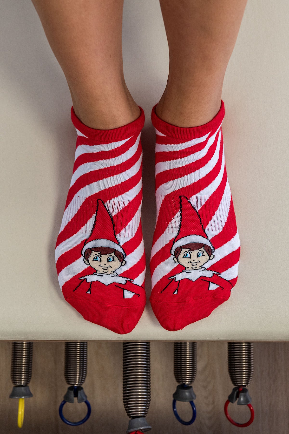 Red and white striped christmas ankle grip socks with the elf on the shelf