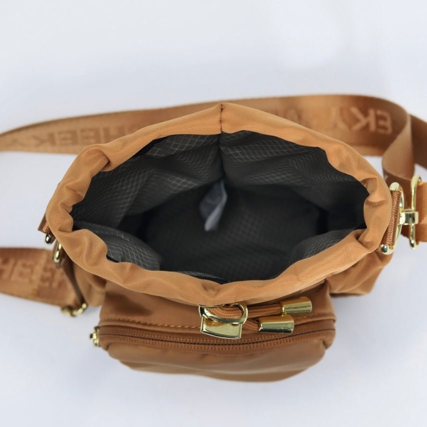 Mocha water bottle bag with anti-theft zips and hidden passport pocket by Cheeky Winx