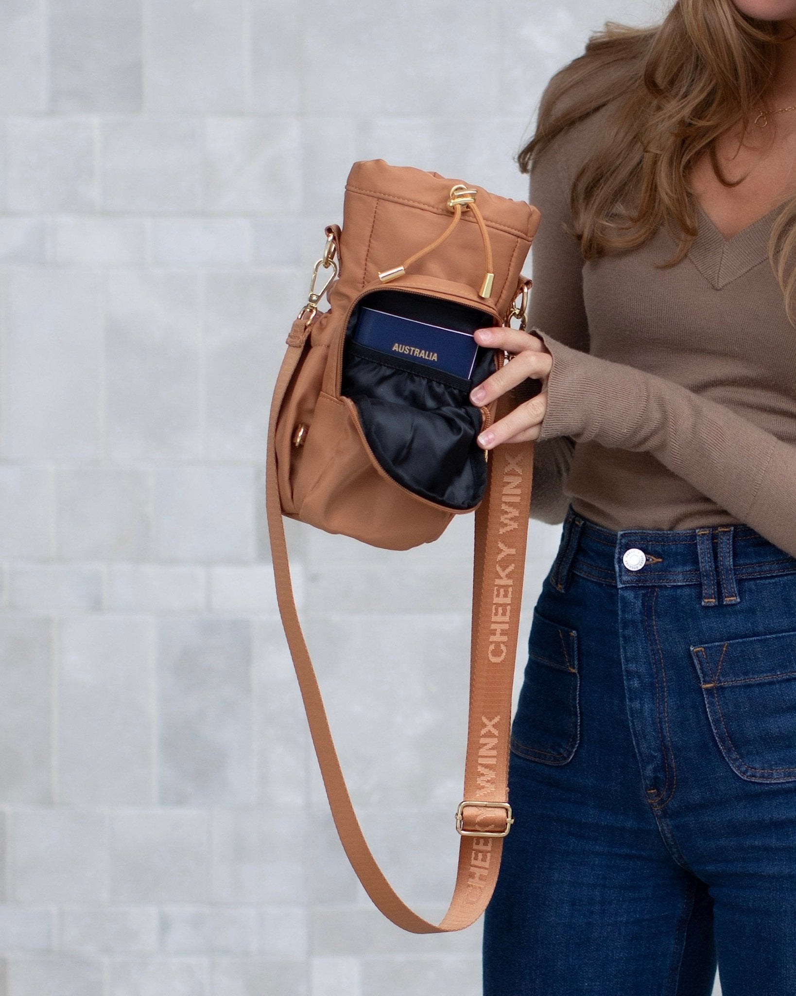 Mocha water bottle bag with anti-theft zips and hidden passport pocket by Cheeky Winx