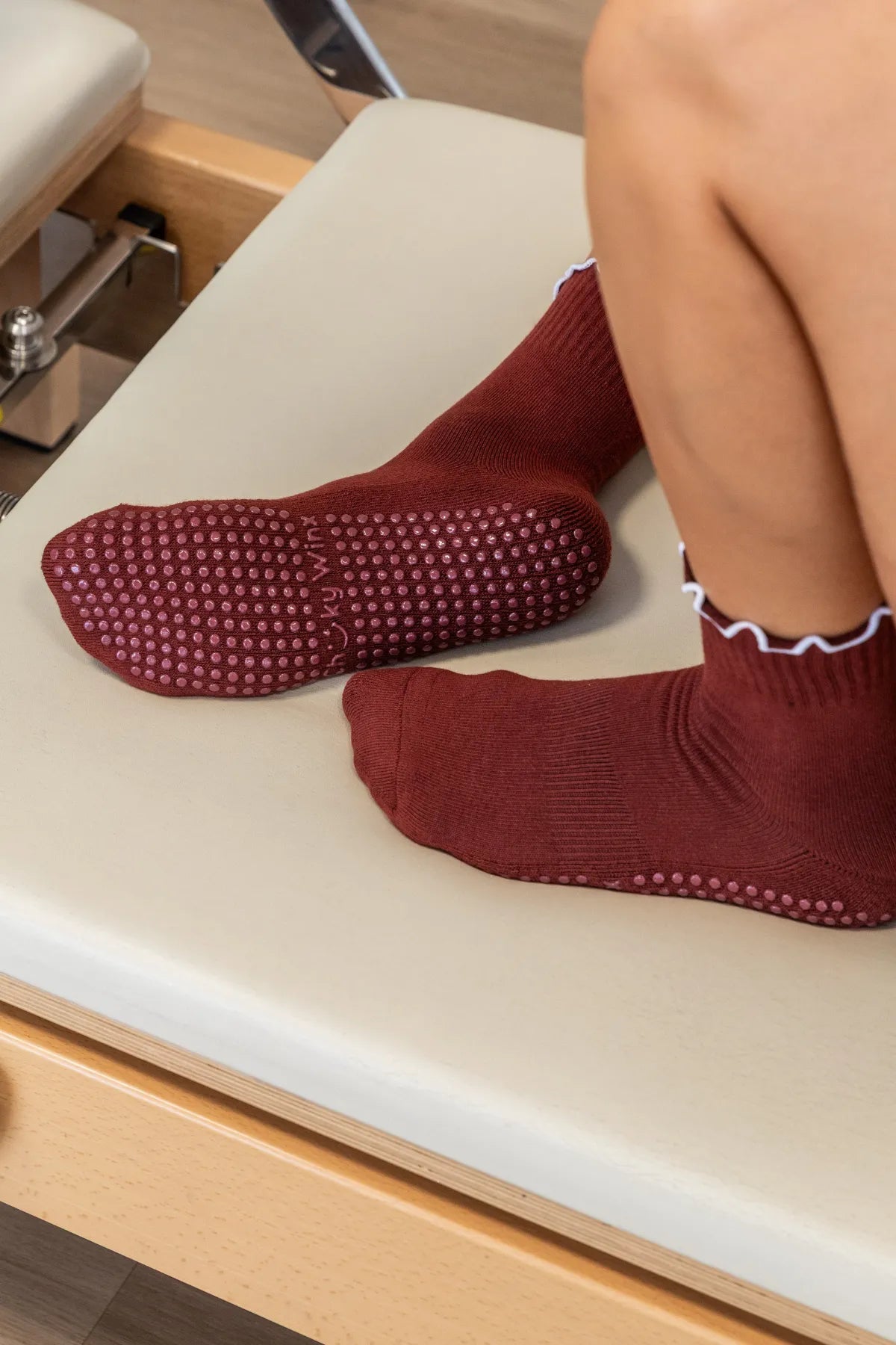 Maroon frilly grip socks with decorative frill and non-slip sole for reformer, Pilates, yoga, and barre by Cheeky Winx. Australia's best grip socks.
